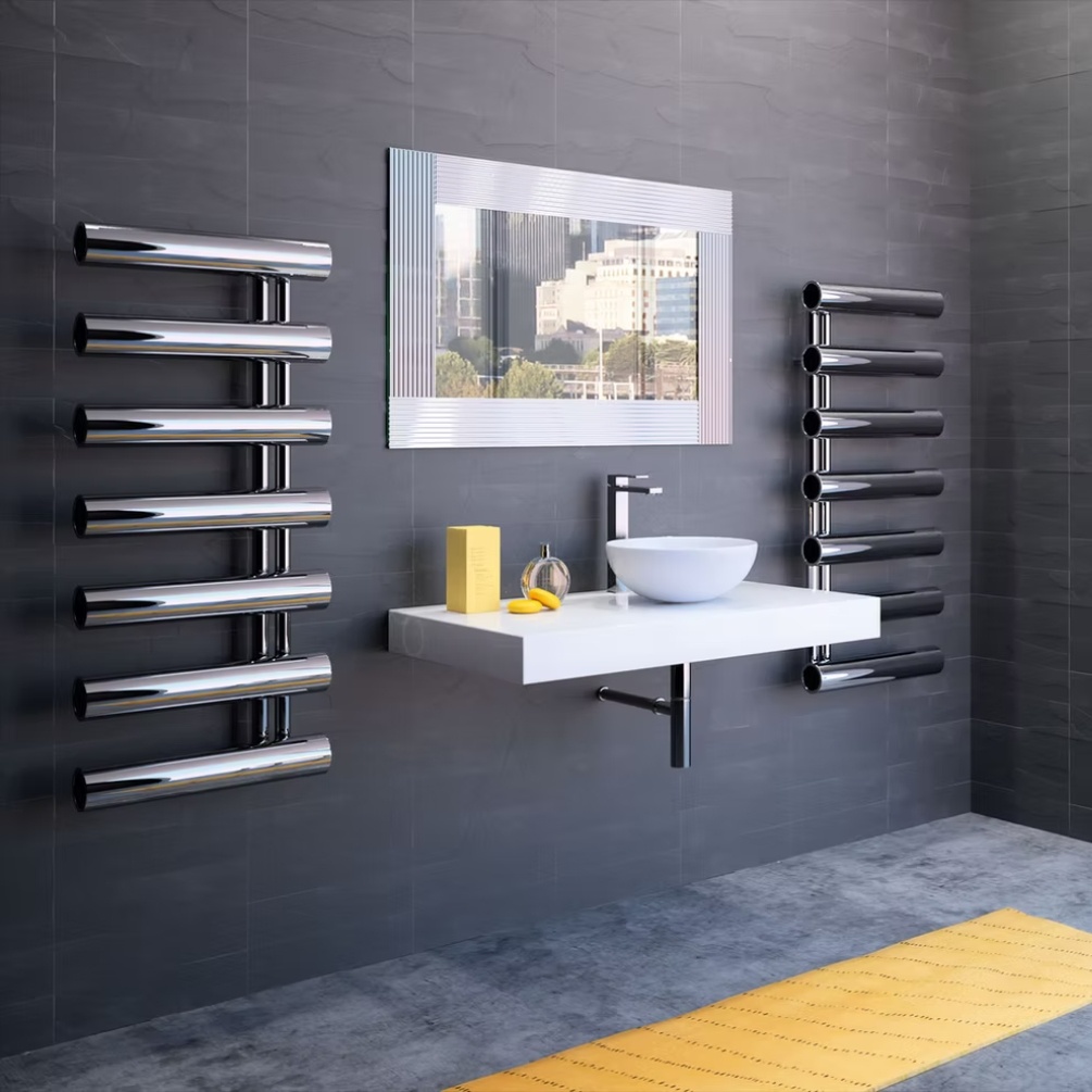 Lifestyle image of two Radox Cannon 1156mm x 500mm Stainless Steel Heated Radiator mounted on a wall, either side of a wall-mounted countertop basin